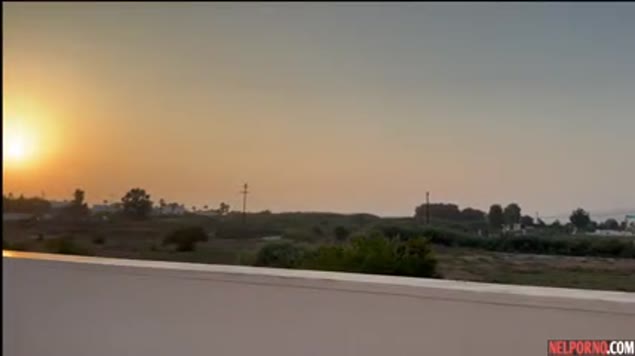Girl with a big ass fucks her guy with a sunset view