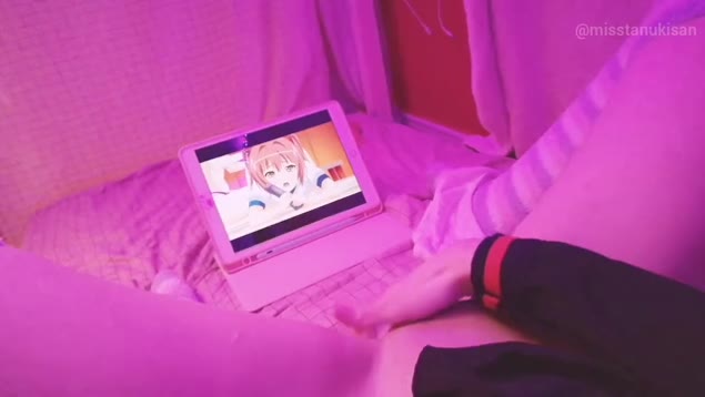 Young girl watches anime porn and fingers her wet pussy